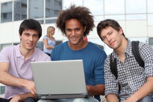 Students at college campus with laptop computer